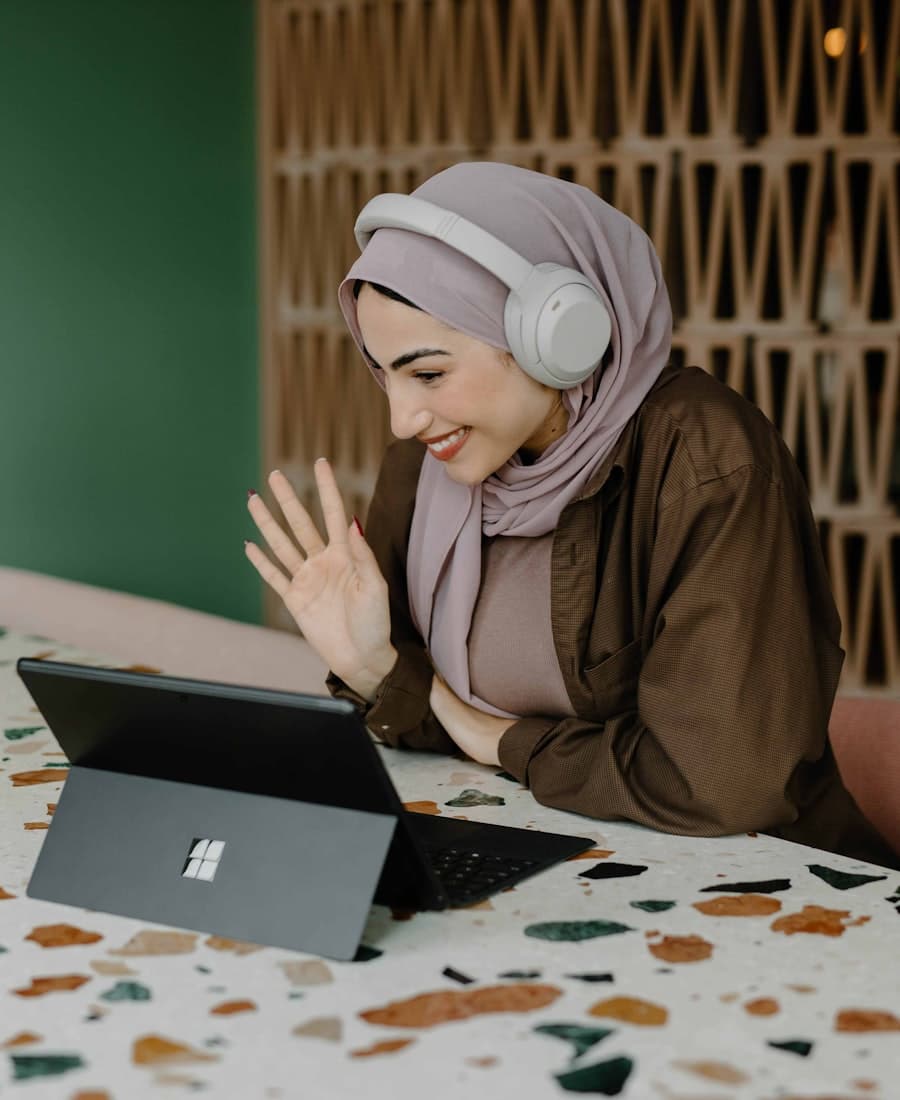 A tutor greeting a student at the start of an online lesson