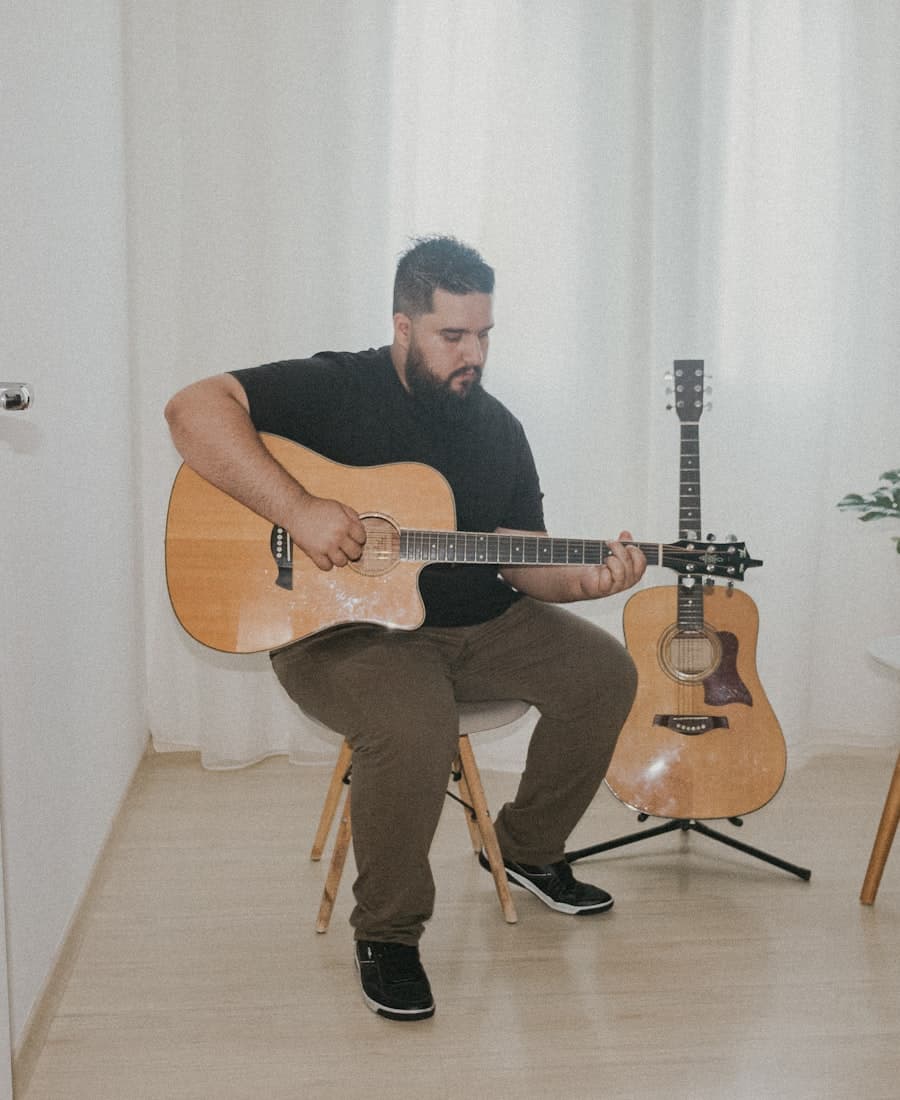 A guitar teacher in his own practice room